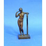 A 19thC classical bronze figure of a Nude, she standing, her arm resting on a post, on square