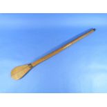 A Pacific style War Club, of spoon form, 27in (68.5cm) long. THIS LOT WILL BE SOLD ON SATURDAY