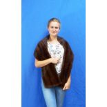 A vintage chestnut brown Mink Stole, with shaped shoulders, lined with glossy satin. THIS LOT WILL