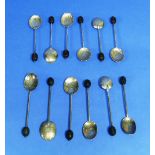 A set of six silver Coffee Bean spoons, hallmarked Birmingham, 1956, with shell chased bowls, cased,