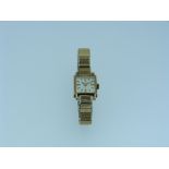 A 9ct gold Tissot lady's Wristwatch, the square silvered dial with baton markers, on gold-plated