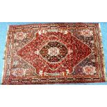 Tribal rugs; a Persian Hamadan rug, pale red ground with all over stylized floral and tree of life