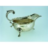 An Edwardian silver Sauce Boat, by Henry Stratford Ltd, hallmarked London, 1908, of oval form with