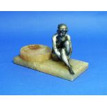 A French Art Deco silvered spelter figural Pin Tray, modelled as a nude seated beside a circular