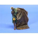 A late 19thC Austrian cold painted bronze figure of an Arab carpet seller, the bearded figure