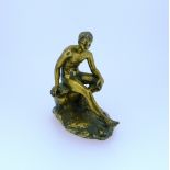 A 19thC French gilt bronze figure of Hermes, seated on a rock and shaped oval base, 4⅛in (10.5cm)