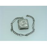 A silver Watch Chain, with regular and elongated twist links, suspending a silver vesta case,