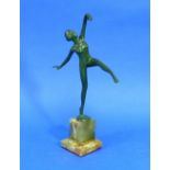 A French Art Deco green patinated bronze figure of a nude Dancer, on stepped green marbled base,