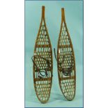 A pair of vintage Snow Shoes, by Tubbs of Wallingford, Vermont, formed of bent wood frames with