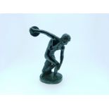 A late 19thC patinated bronze figure of a Discus Athlete, on oval base, 5in (12.5cm) high. THIS