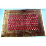 Tribal rugs; a fine Afghan rug, dark pink/maroon ground with all over tekke/gul design, set within a