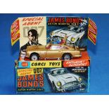 Corgi No.261 James Bond's Aston Martin D.B.5., gold with red interior and wire wheels, James Bond