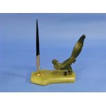 An Art Deco green marble Pen Stand, of shaped rectangular form, surmounted by a stylised bronze