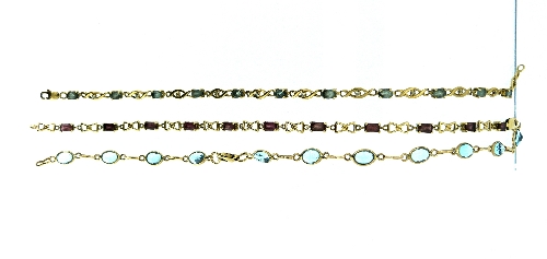 Three Bracelets, one in 9k yellow gold comprising eleven pale blue stones between yellow gold links,