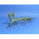 An early 20thC green patinated bronze Chinese Dragon, 12½in (31.5cm) long. THIS LOT WILL BE SOLD