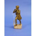 A gilt bronze figure of a Boy, wearing clogs and playing the harmonica, on square polished stone