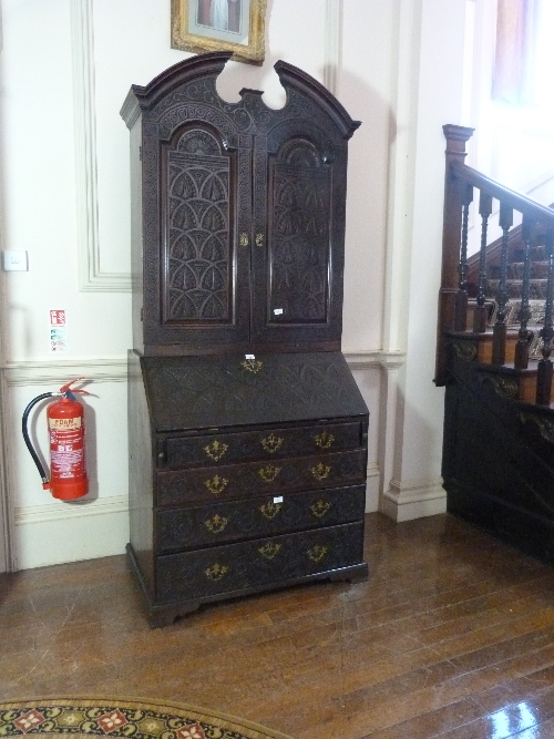 A Victorian carved oak Bureau Cabinet, with fitted interiors, 38½in (98cm) wide. Provenance: - Image 3 of 3