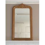 A giltwood framed overmantel Mirror, 32in (81cm) wide. Provenance: Stoodley Knowle School, Torquay.