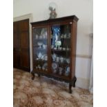 An early 20thC mahogany Bookcase, with astragal glazed doors, 55in (140cm) wide. Provenance: