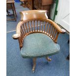 An early 20thC oak desk Chair.