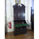 A Victorian carved oak Bureau Cabinet, with fitted interiors, 38½in (98cm) wide. Provenance: