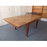 An oak draw-leaf Dining Table, with square tapering legs.