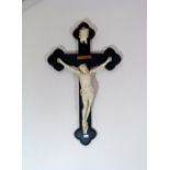 A plaster and wood Crucifix, 40in (101.5cm) high. Provenance: Stoodley Knowle School, Torquay.