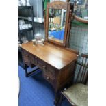 A mid 20thC carved oak Dressing Table