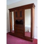 An Edwardian walnut Wardrobe, 73in (185.5cm) wide. Provenance: Stoodley Knowle School, Torquay.