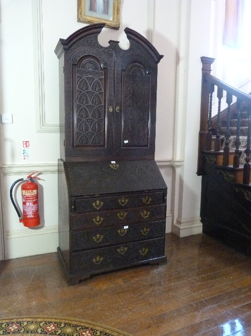 A Victorian carved oak Bureau Cabinet, with fitted interiors, 38½in (98cm) wide. Provenance: - Image 2 of 3