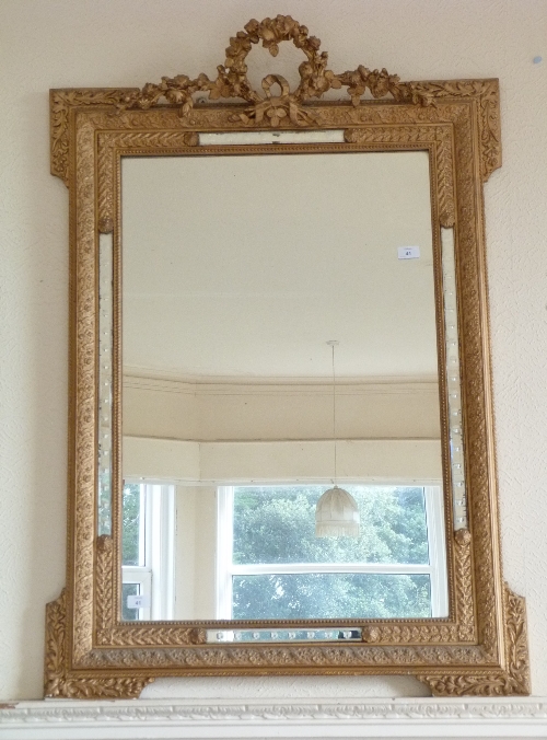 A giltwood and moulded wall Mirror, 32in (81cm) wide. Provenance: Stoodley Knowle School, Torquay.