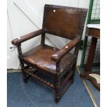 A Carolean style oak and leather carver Dining Chair