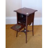 An Edwardian mahogany Tea Table, fitted with four fold-out plate trays, 28in (71cm) high.
