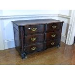 An early 20thC French elm serpentine Chest of Drawers, 51in (129.5cm) wide. Provenance: Stoodley