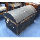 A domed pine Trunk, stained black covering.