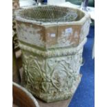 A large stone octagonal Planter, with moulded floral decoration.