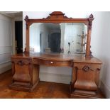 A late Victorian mahogany pedestal Sideboard, with mirrored back, 85in (216cm) long. Provenance: