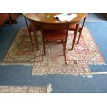 A pair of Turkish handmade rugs, together with another similar (3)