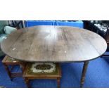 A French oak plank top kitchen Table, on a walnut base.