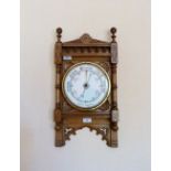 An Edwardian oak cased Aneroid Barometer, 22in (56cm) high. Provenance: Stoodley Knowle School,