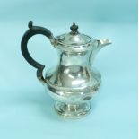 A George V silver hot water Jug, hallmarked Birmingham, 1932, of baluster form with beaded girdle
