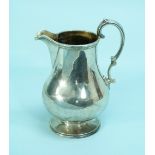 A Victorian silver Jug, by Daniel and Charles Houle, hallmarked London, 1860, of baluster form