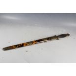 An antique S.E. Asian tortoiseshell sheathed double edged short sword.