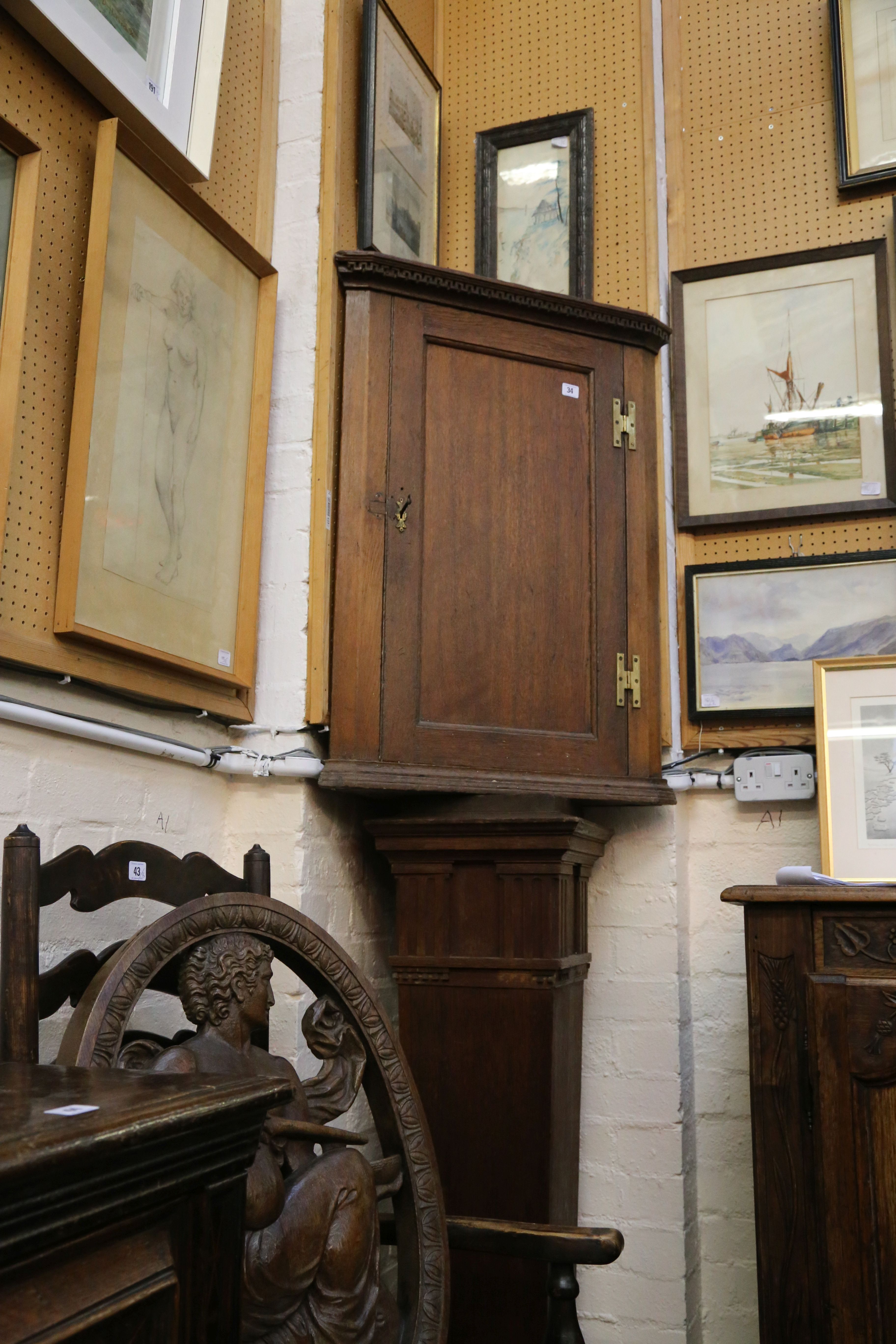 A 19th Century oak wall hanging corner cabinet.