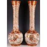 A pair of rare and impressively large kutani ceramic bottle form vases (now fitted for use as