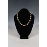 A cultured pearl, topaz and faceted onyx necklace with 9ct gold clasp.