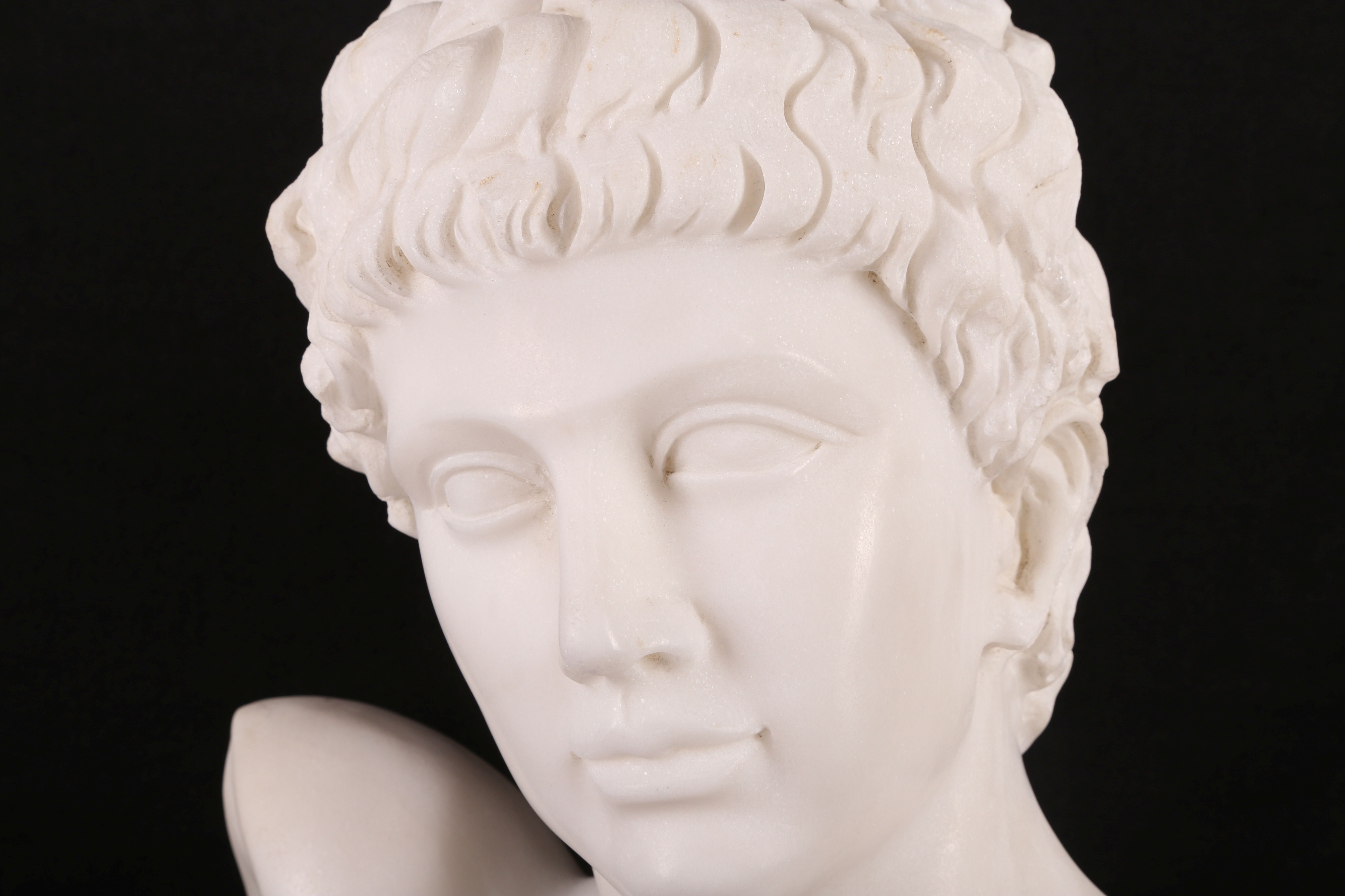 A white marble bust of Adonis, after the Antique, on a socle, 62cm H approx. (on socle). - Image 2 of 2