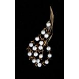 An 18ct gold and pearl brooch in the form of a spray of flowers.