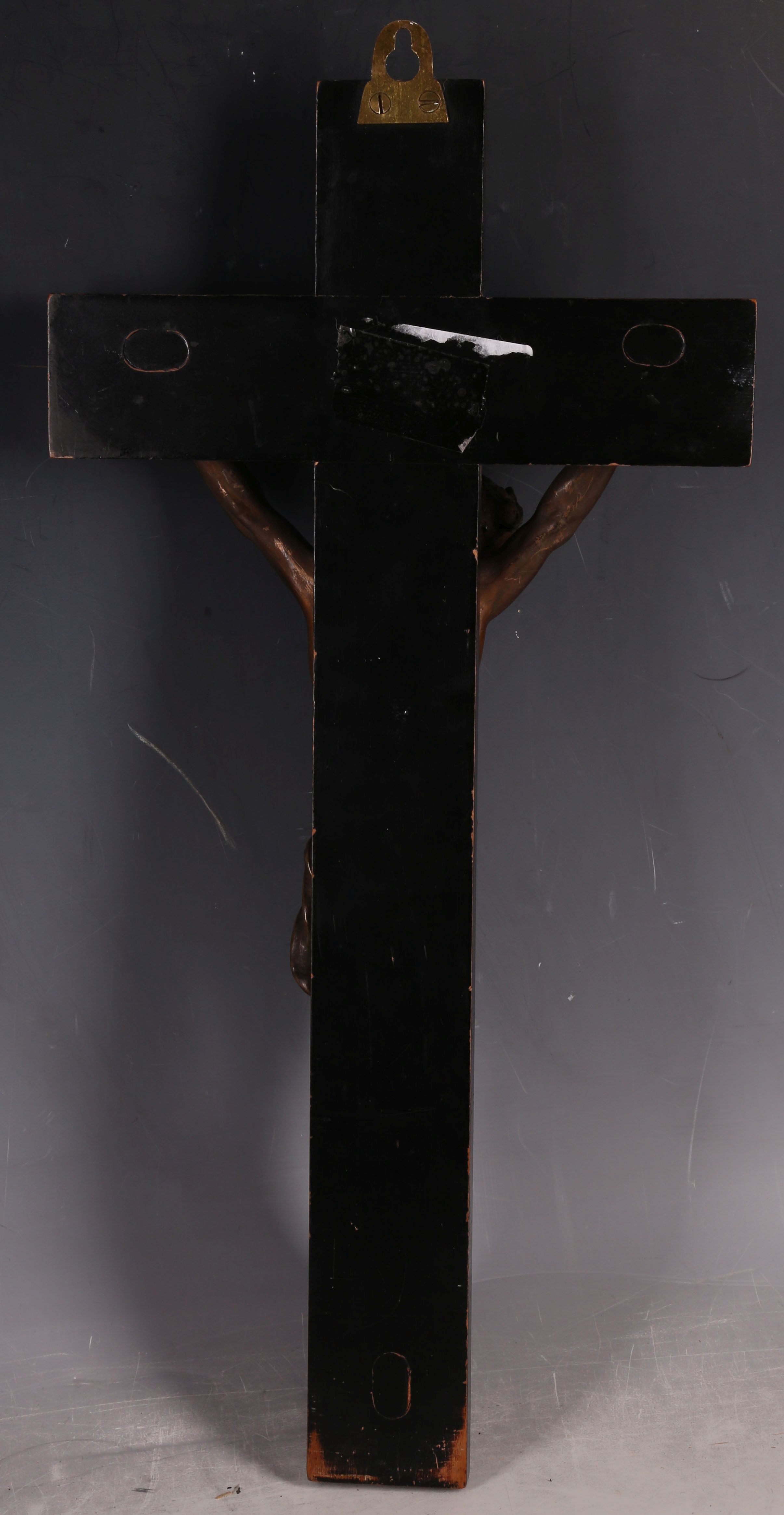 A late 19th Century bronze crucifix, the bronze corpus on an ebonised fruit wood cross, 40 x 20cm. - Image 2 of 3