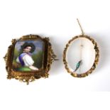 A Victorian brooch, set with enamel plaque of a young woman in ormolu mount, together with another